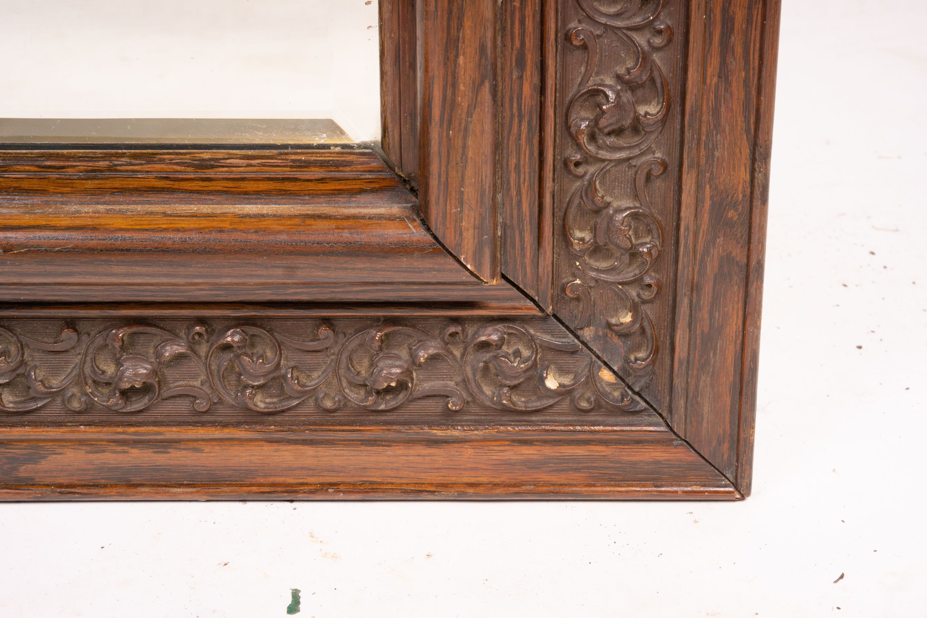 An early 20th century carved oak rectangular wall mirror, width 57cm, height 64cm